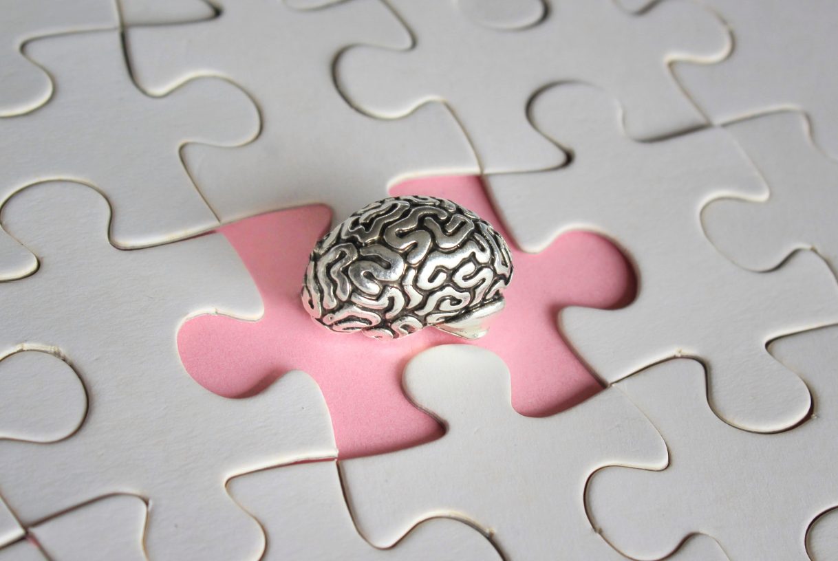 Illustration of a brain with a missing puzzle piece